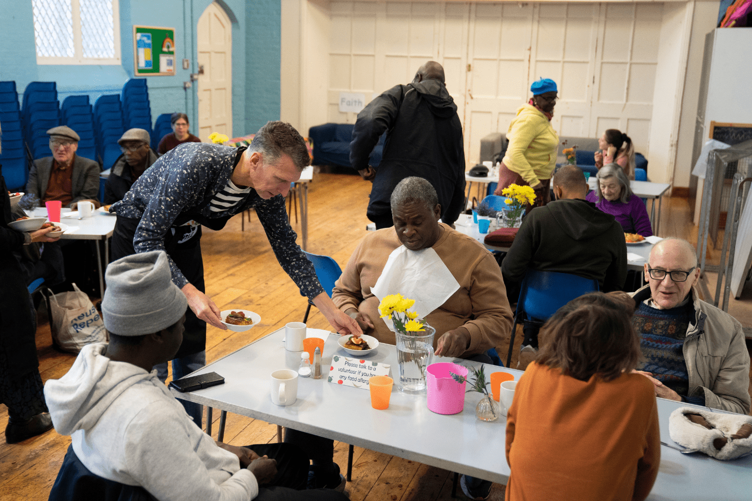 Sit down community meal being served