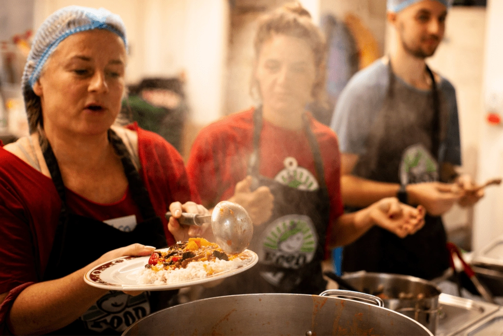 People serving hot food