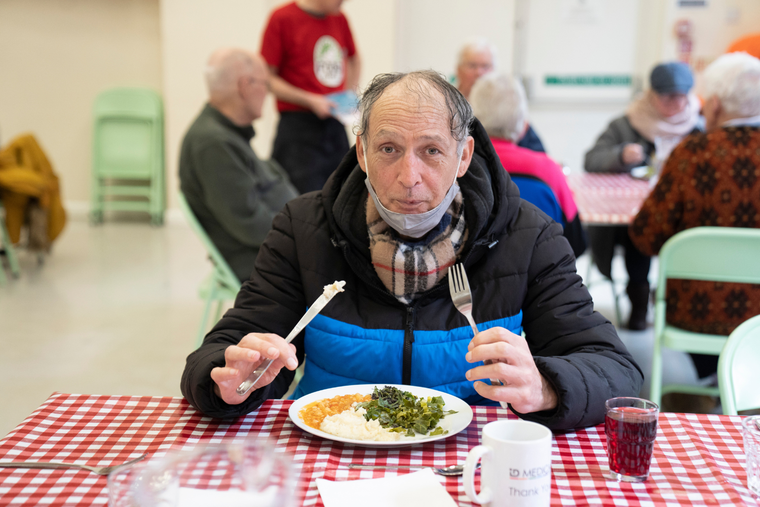 Man eating FoodCycle community meal