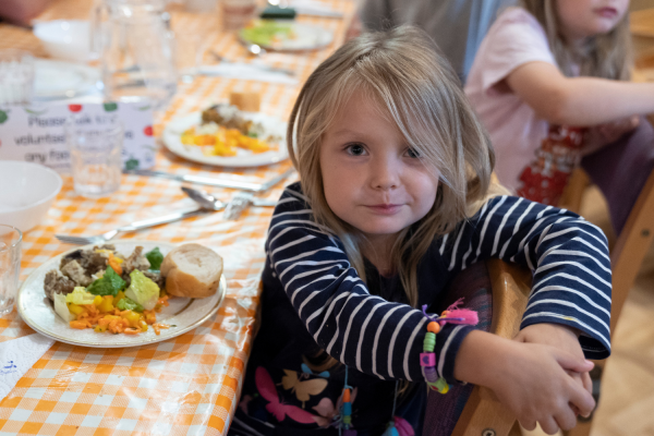 Child at community meal